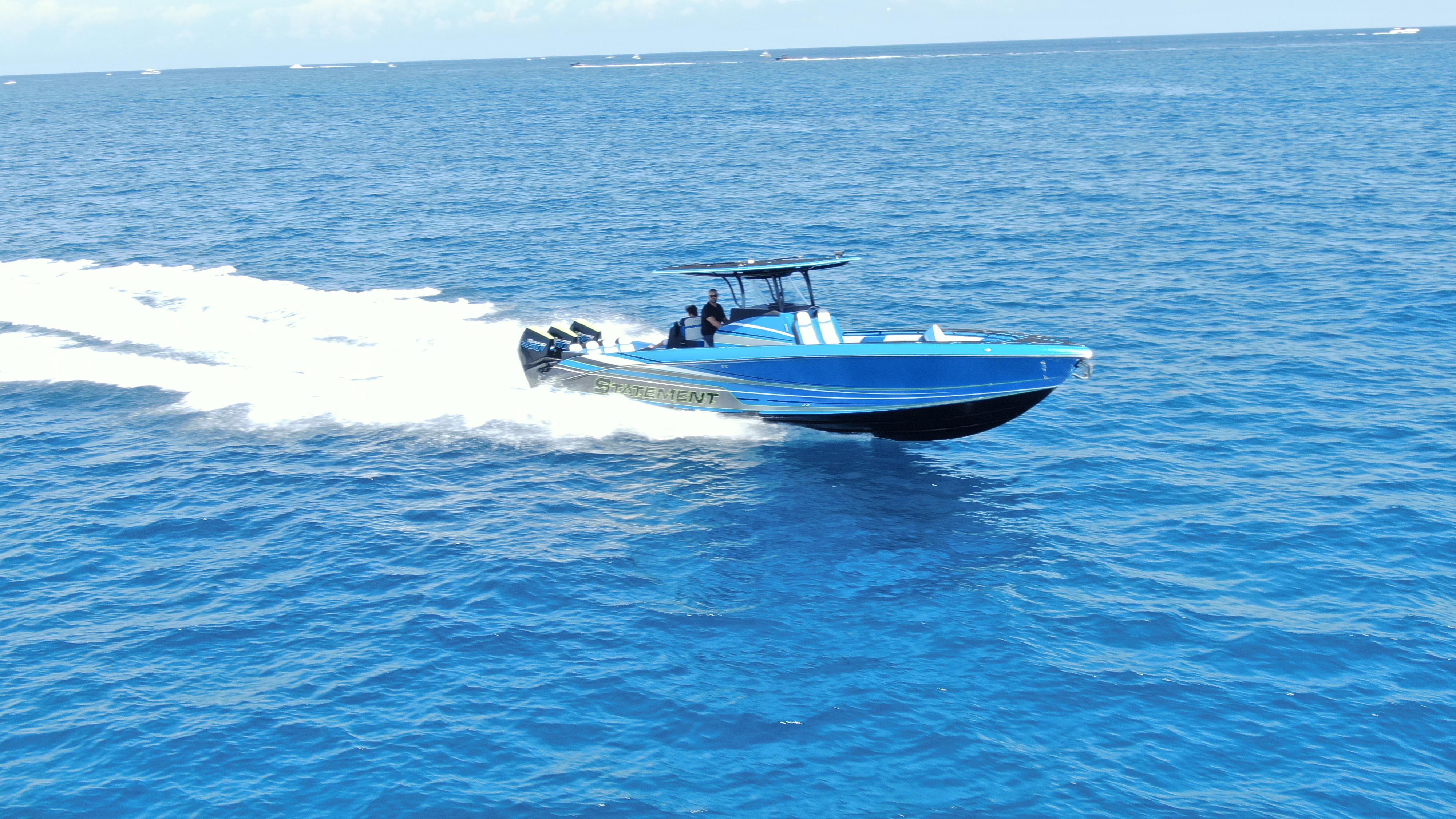 2023 Statement 380 Open speedboat cruising on open blue ocean waters.