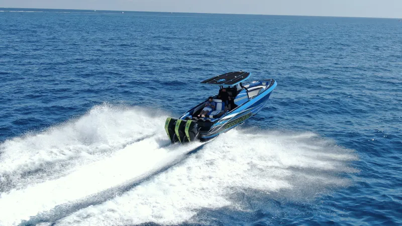 Riptide Yacht Photos Pics 2023 Statement 380 Open speedboat cruising on open blue ocean waters.