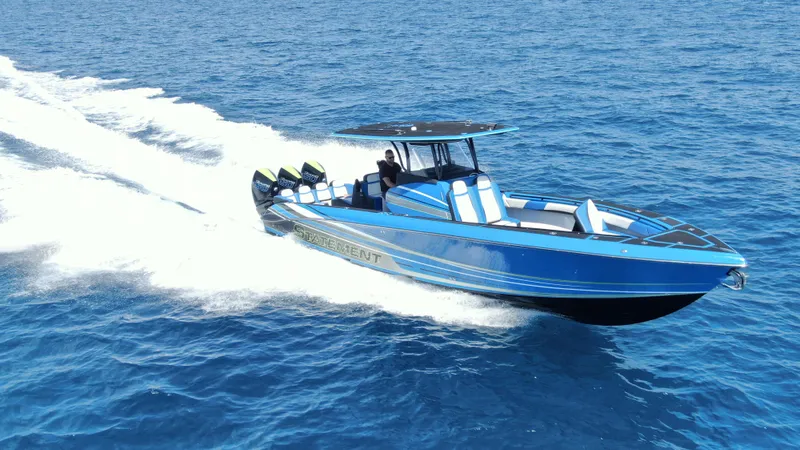 Riptide Yacht Photos Pics 2023 Statement 380 Open boat cruising on blue ocean waters.