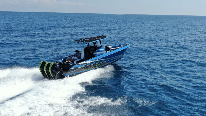 Riptide Yacht Photos Pics 2023 Statement 380 Open boat cruising on open sea, showcasing sleek design and powerful engines.
