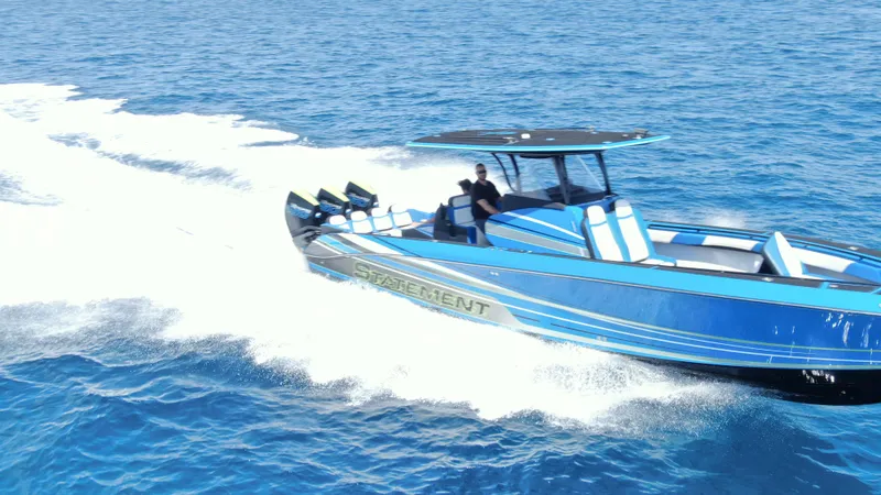 Riptide Yacht Photos Pics 2023 Statement 380 Open boat cruising on blue ocean waters.