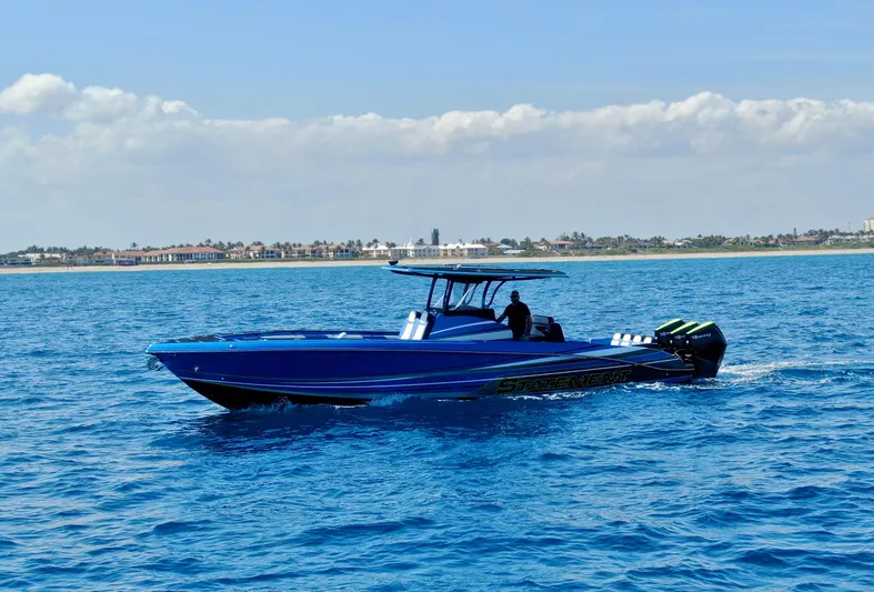 Riptide Yacht Photos Pics 2023 Statement 380 Open boat cruising on blue ocean waters.