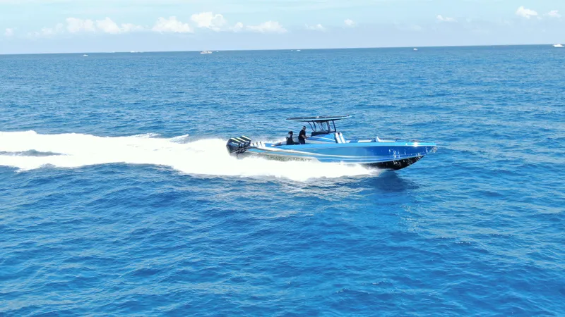 Riptide Yacht Photos Pics 2023 Statement 380 Open boat cruising on open blue ocean waters.