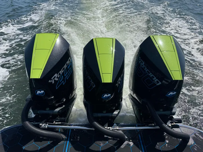 Riptide Yacht Photos Pics Triple Mercury Racing engines on 2023 Statement 380 Open boat, cruising on water.