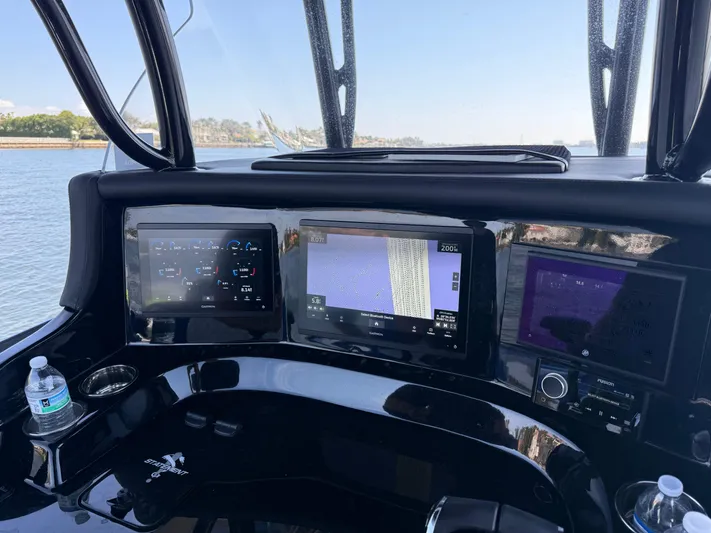 Riptide Yacht Photos Pics Dashboard of 2023 Statement 380 Open boat with navigation screens and controls.