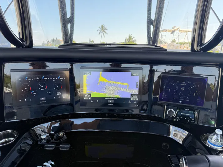 Riptide Yacht Photos Pics Dashboard of 2023 Statement 380 Open boat with navigation and control screens.