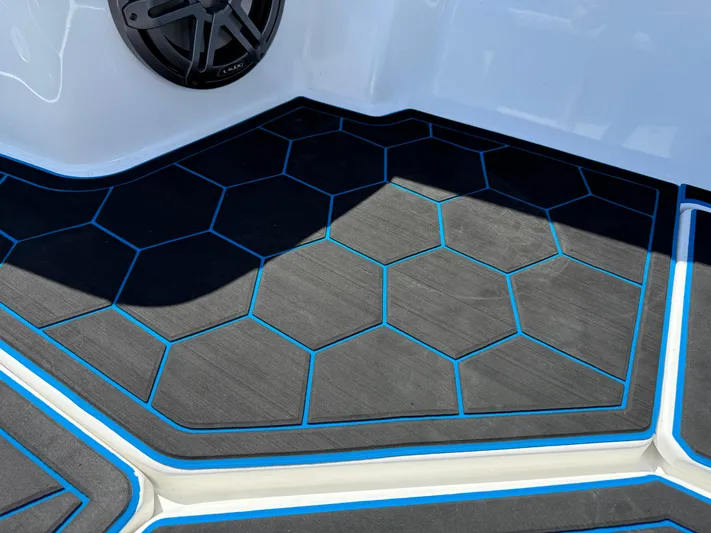 Riptide Yacht Photos Pics Hexagonal patterned flooring on 2023 Statement 380 Open boat deck.
