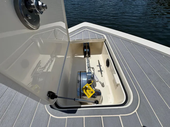  Yacht Photos Pics 2025 Scout 281 XSS boat anchor compartment with open hatch, showing chain and winch.
