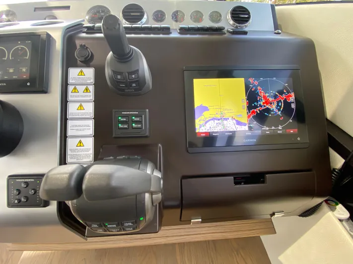 2022 Fairline Targa 50 Gt Yacht Photos Pics Cockpit controls of 2022 Fairline Targa 50 GT with navigation display.