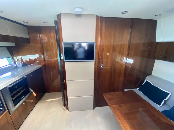 2022 Fairline Targa 50 Gt Yacht Photos Pics Luxurious interior of 2022 Fairline Targa 50 GT yacht with modern kitchen and seating area.