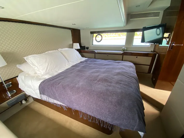 2022 Fairline Targa 50 Gt Yacht Photos Pics Luxurious bedroom interior of 2022 Fairline Targa 50 GT yacht with elegant bedding and modern decor.
