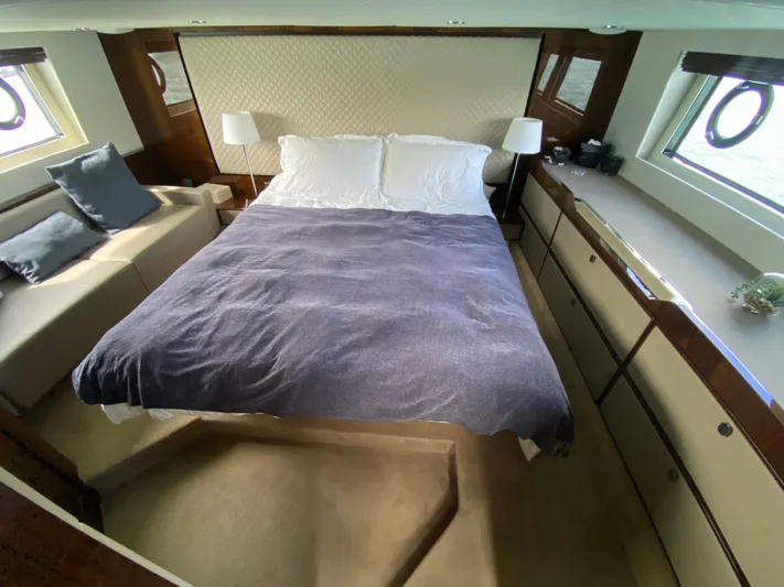 2022 Fairline Targa 50 Gt Yacht Photos Pics Luxurious bedroom interior of 2022 Fairline Targa 50 GT yacht with cozy bed and elegant decor.