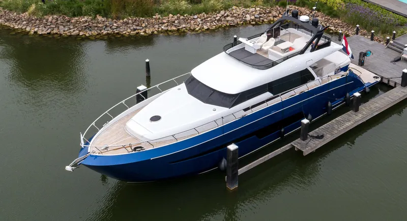  Yacht Photos Pics Luxury 2021 Van der Heijden Phantom 70 Fly yacht docked in a serene marina.