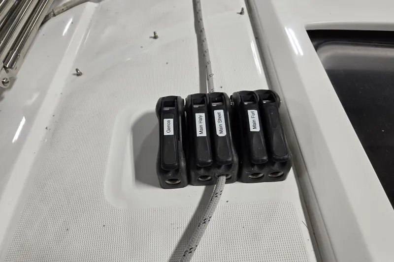 Mahalo Yacht Photos Pics Beneteau Oceanis 30.1 sailboat deck with labeled rope clutches, 2021 model.