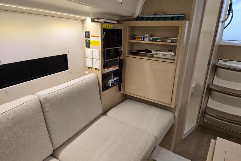 Mahalo Yacht Photos Pics Interior of 2021 Beneteau Oceanis 30.1 yacht with beige seating and storage.