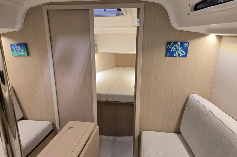 Mahalo Yacht Photos Pics Interior of 2021 Beneteau Oceanis 30.1 yacht, featuring cozy seating and modern design.