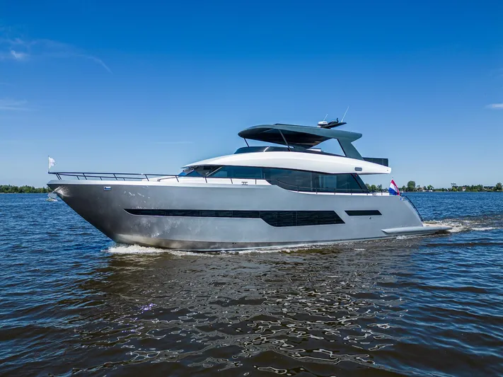  Yacht Photos Pics Luxury 2024 Van der Heijden Phantom Expedition yacht cruising on open water.