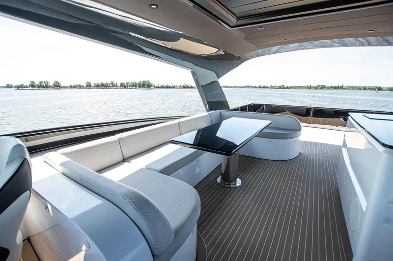  Yacht Photos Pics Luxurious 2024 Van der Heijden Phantom Expedition yacht interior with elegant seating and table.