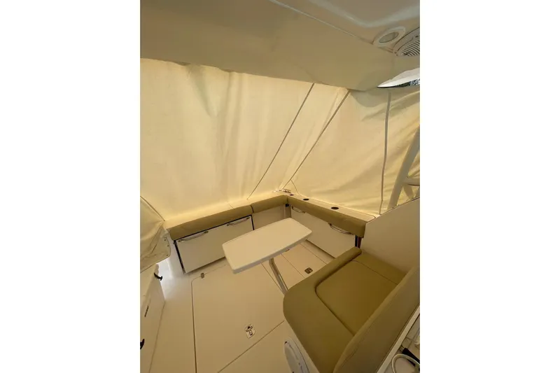  Yacht Photos Pics Interior of 2016 Pursuit DC 325 Dual Console boat with seating and table.