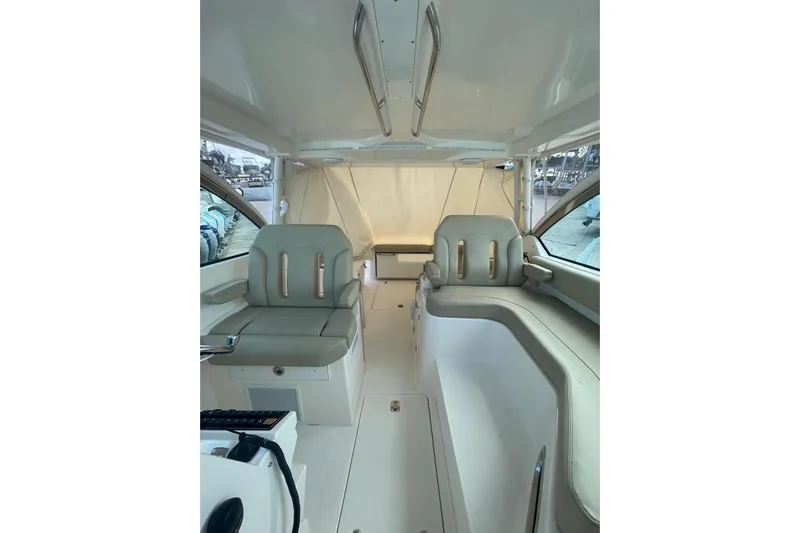  Yacht Photos Pics Interior of 2016 Pursuit DC 325 Dual Console boat with seating and helm area.