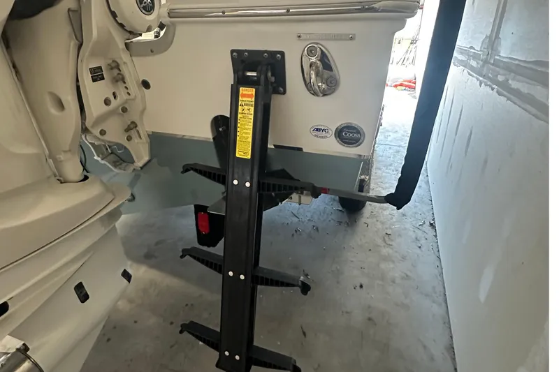  Yacht Photos Pics 2022 Sea Hunt Gamefish 30 Coffin Box boat with trailer and ladder in garage.