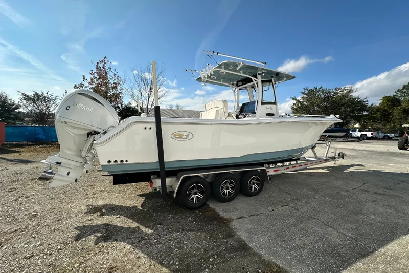  Yacht Photos Pics 2022 Sea Hunt Gamefish 30 Coffin Box boat on trailer, featuring Yamaha engines.