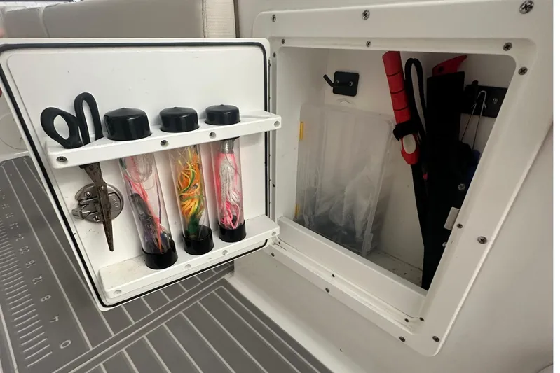  Yacht Photos Pics Storage compartment on 2022 Sea Hunt Gamefish 30 Coffin Box with fishing gear and tools.
