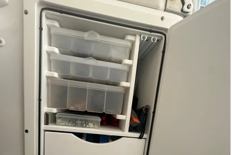  Yacht Photos Pics Storage compartment with tackle boxes on a 2022 Sea Hunt Gamefish 30 Coffin Box boat.