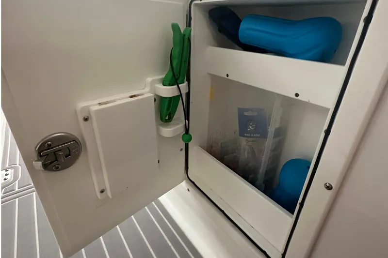  Yacht Photos Pics 2022 Sea Hunt Gamefish 30 Coffin Box storage compartment with fishing gear and accessories.