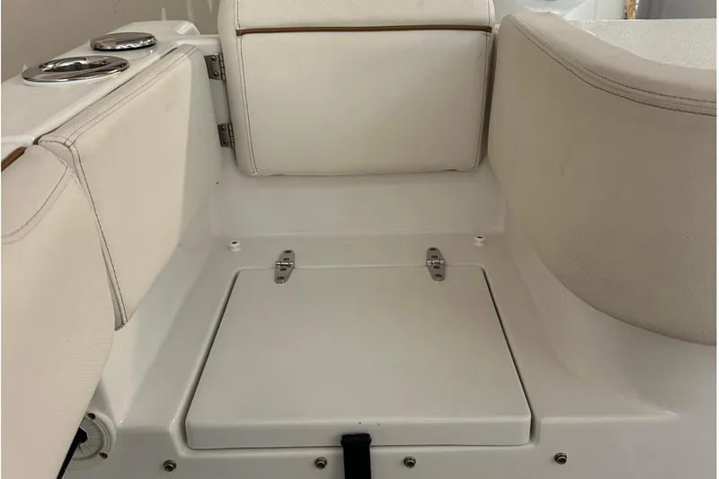  Yacht Photos Pics 2022 Sea Hunt Gamefish 30 Coffin Box interior seating area with storage compartment.