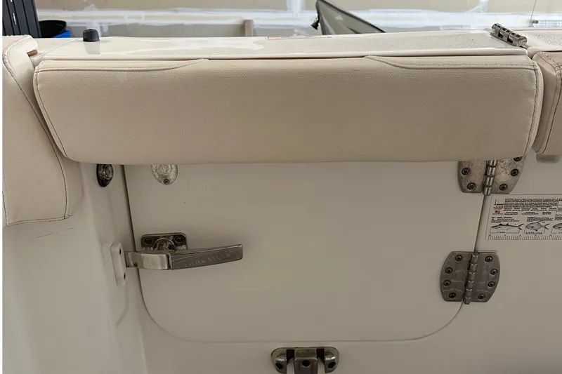  Yacht Photos Pics 2022 Sea Hunt Gamefish 30 Coffin Box boat interior with cushioned seating and latch.