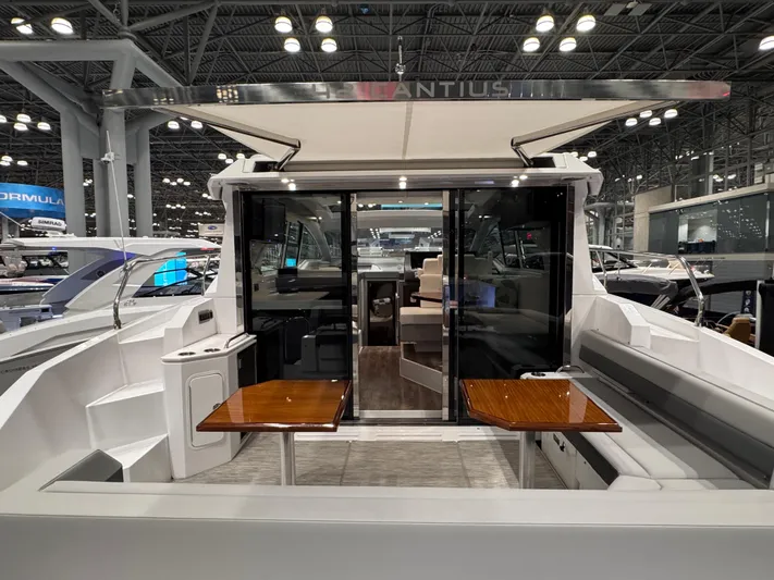 2024 Cruisers 42 Cantius Yacht Photos Pics 2024 Cruisers Yachts 42 Cantius luxury boat interior with seating and tables.