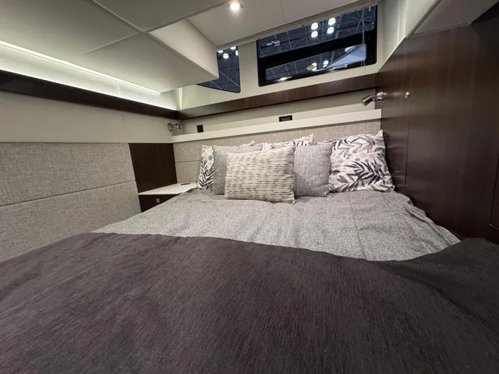 2024 Cruisers 42 Cantius Yacht Photos Pics 2024 Cruisers Yachts 42 Cantius bedroom with modern decor and plush bedding.