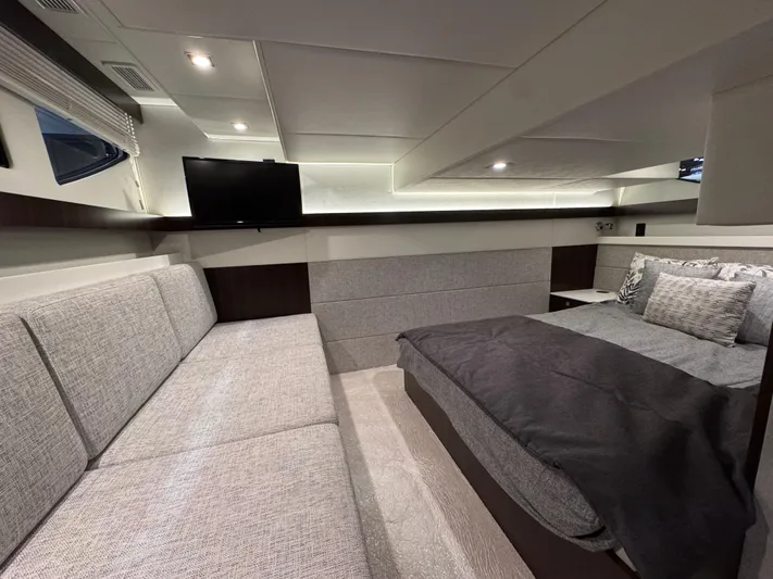 2024 Cruisers 42 Cantius Yacht Photos Pics Luxurious interior of 2024 Cruisers Yachts 42 Cantius with modern furnishings and cozy bedding.