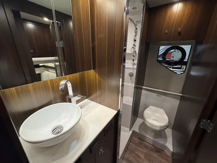 2024 Cruisers 42 Cantius Yacht Photos Pics Luxurious bathroom in 2024 Cruisers Yachts 42 Cantius, featuring modern sink and toilet.