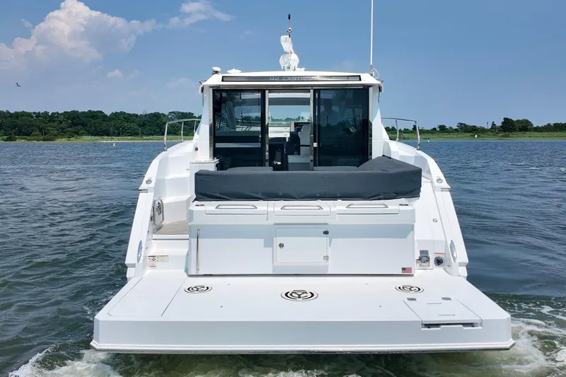 2024 Cruisers 42 Cantius Yacht Photos Pics 2024 Cruisers Yachts 42 Cantius on water, rear view showcasing sleek design.