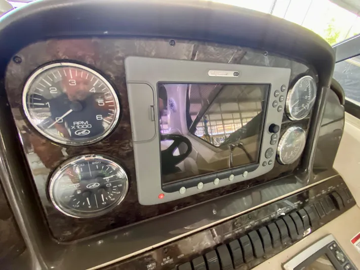  Yacht Photos Pics Dashboard of 2008 Sea Ray 38 Sundancer with gauges and navigation screen.