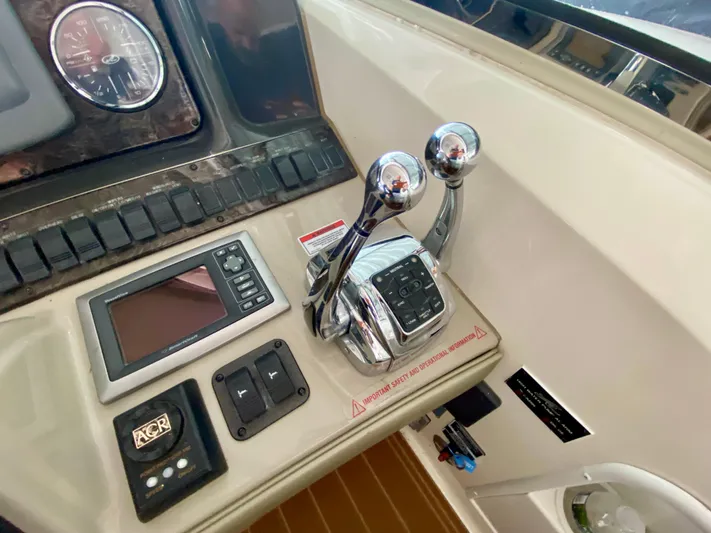  Yacht Photos Pics Control panel of 2008 Sea Ray 38 Sundancer with throttle levers and navigation display.