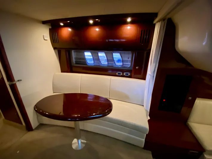  Yacht Photos Pics Luxurious interior of 2008 Sea Ray 38 Sundancer yacht with elegant seating and table.