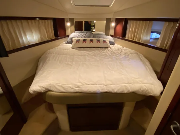  Yacht Photos Pics Luxurious cabin interior of 2008 Sea Ray 38 Sundancer yacht with cozy bedding.