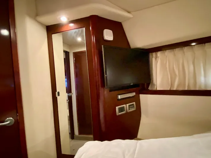  Yacht Photos Pics Interior of 2008 Sea Ray 38 Sundancer with TV, mirror, and wood paneling.