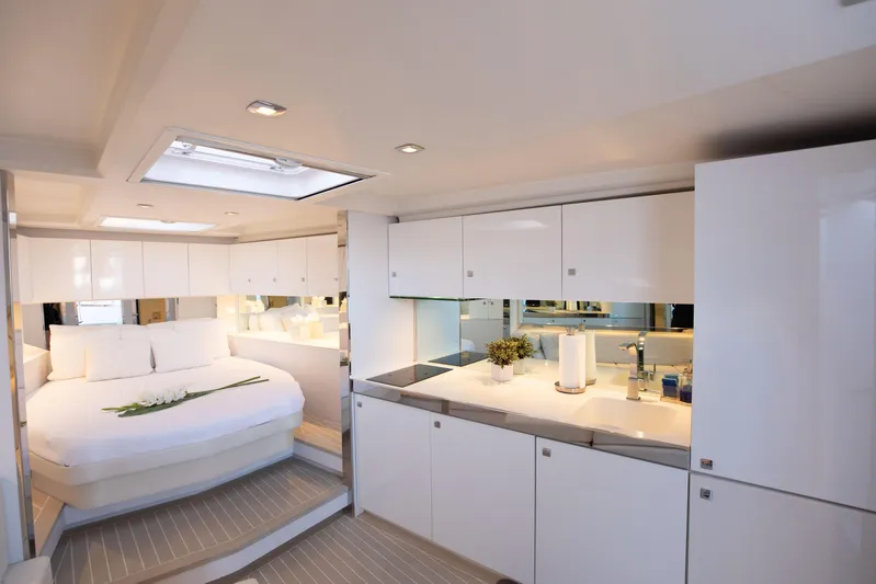M/y 55 Van Dutch Yacht Photos Pics Luxurious interior of 2017 VanDutch 55 yacht with modern kitchen and cozy bedroom.