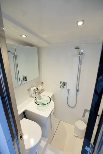 M/y 55 Van Dutch Yacht Photos Pics Modern bathroom in 2017 VanDutch 55 yacht with sleek fixtures and glass sink.