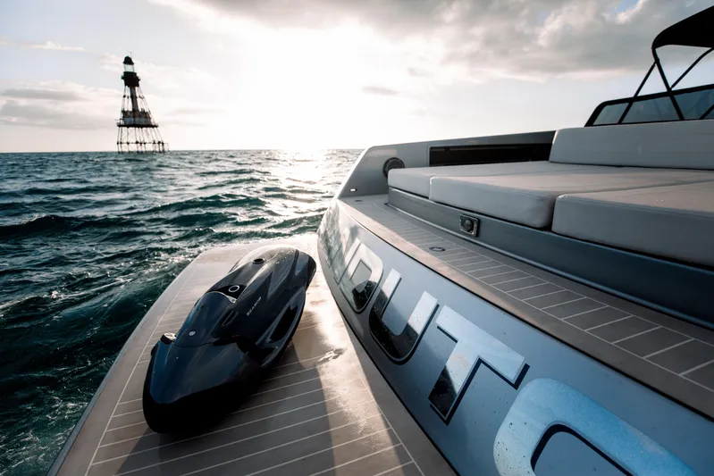 M/y 55 Van Dutch Yacht Photos Pics VanDutch 55 yacht on ocean at sunset, 2017 model, with distant lighthouse.