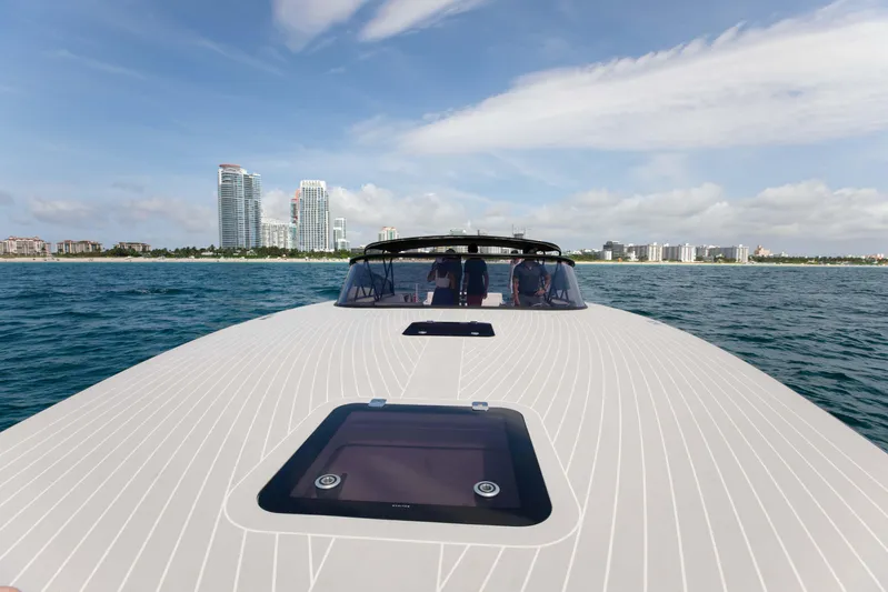M/y 55 Van Dutch Yacht Photos Pics 2017 VanDutch 55 yacht cruising near city skyline on a sunny day.