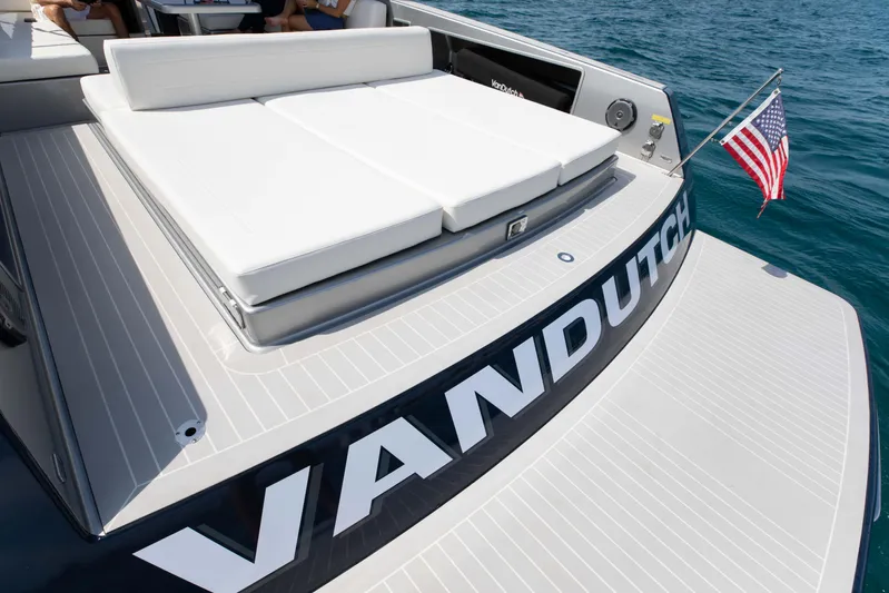 M/y 55 Van Dutch Yacht Photos Pics VanDutch 55 yacht, 2017 model, featuring a spacious sun deck and American flag on open water.