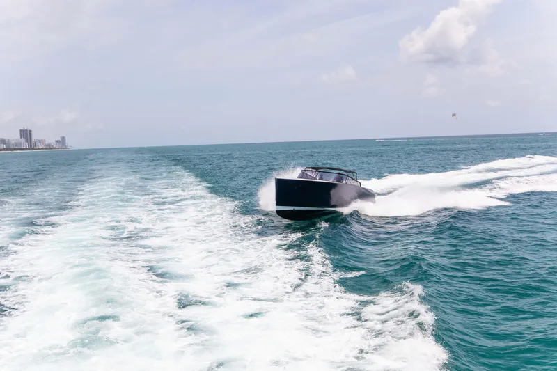 M/y 55 Van Dutch Yacht Photos Pics VanDutch 55 yacht cruising on open sea, 2017 model, leaving a trail of white wake.