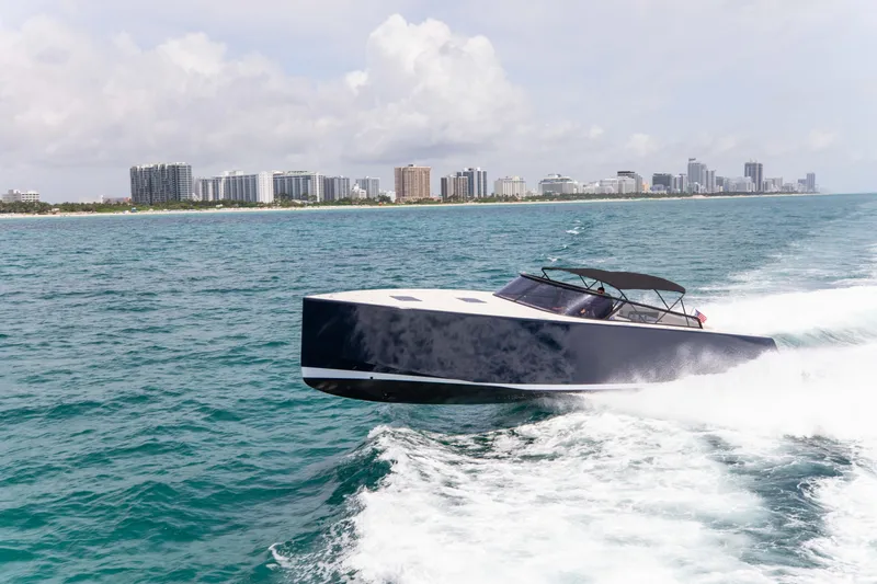 M/y 55 Van Dutch Yacht Photos Pics VanDutch 55 yacht cruising on ocean near city skyline, 2017 model.