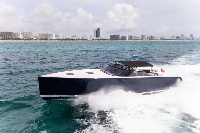 M/y 55 Van Dutch Yacht Photos Pics 2017 VanDutch 55 yacht cruising on ocean near city skyline.