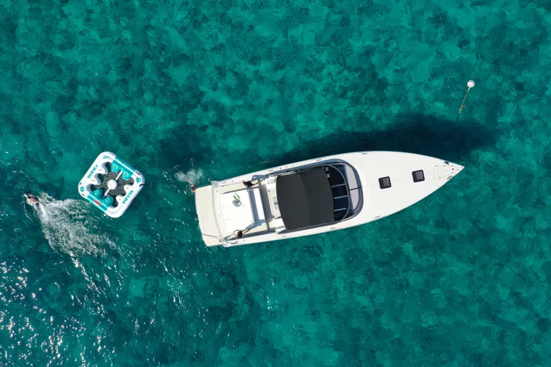 M/y 55 Van Dutch Yacht Photos Pics Aerial view of 2017 VanDutch 55 yacht on clear turquoise water.